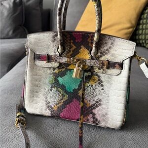 Elegant Black Leather Satchel with Gold Accents